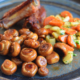 Ribs with honey glazed mushrooms and carrot sauce
